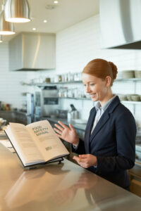 manager looking a food safety manual